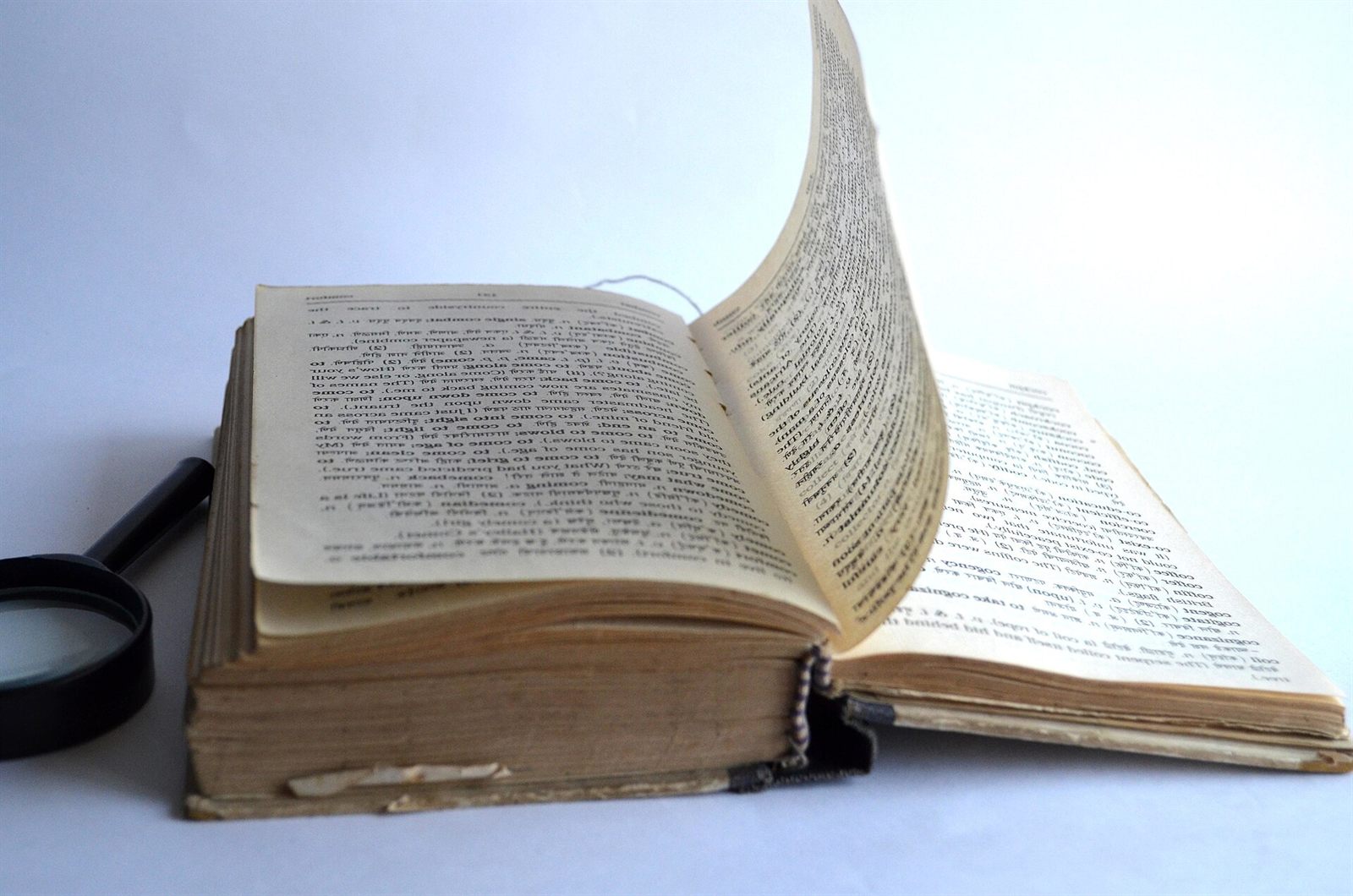 A magnifying glass over printed text