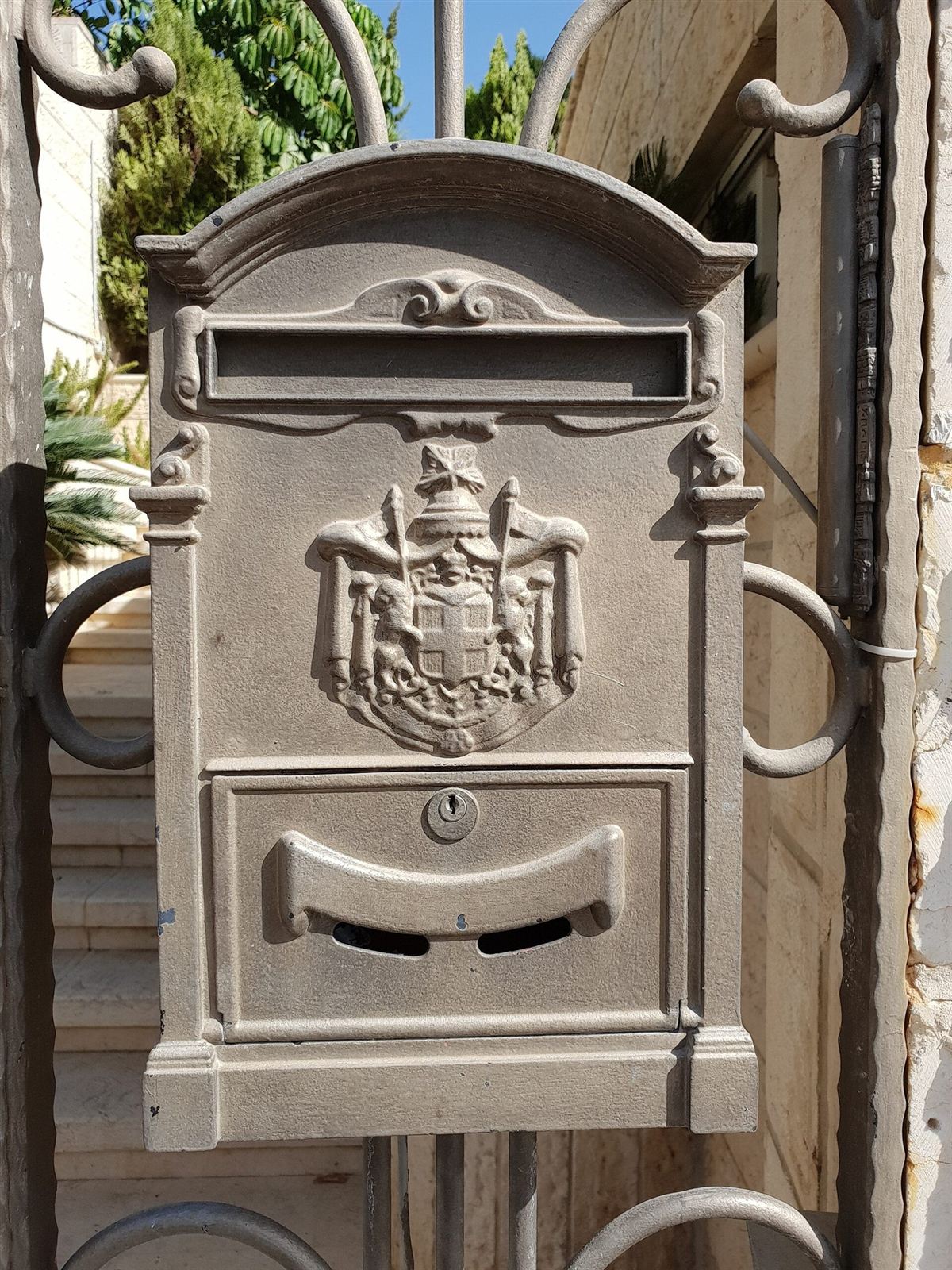 A mailbox on a house gate